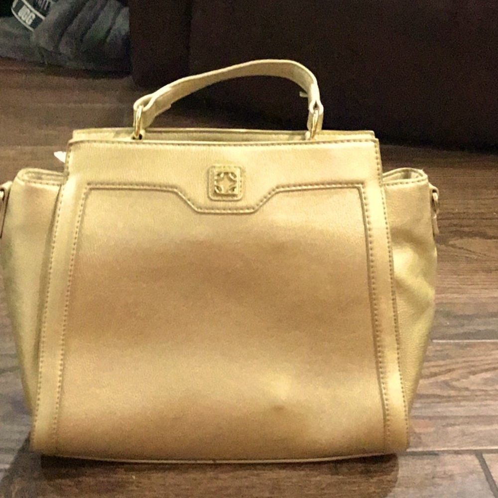 A golden Charming Charlie bag